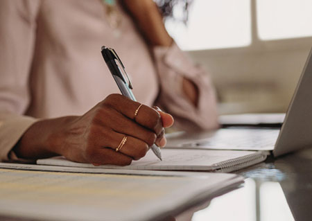 women writing on paper