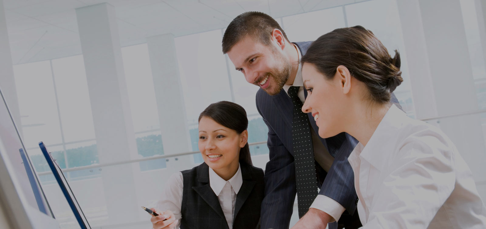 Employees looking at a computer
